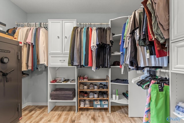 walk in closet featuring light hardwood / wood-style floors