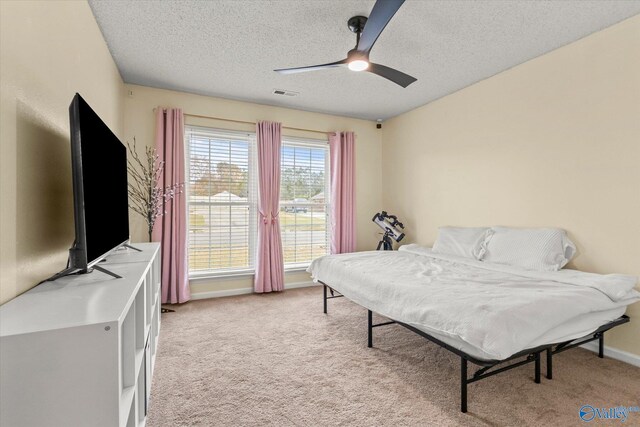 102 Bay Pointe Ln, Madison, AL 35758 - bedroom with a textured ceiling, light carpet, ceiling fan, and baseboards
