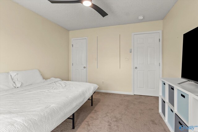 102 Bay Pointe Ln, Madison, AL 35758 - bedroom with light carpet, baseboards, and a ceiling fan