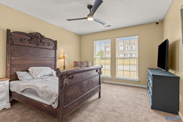 102 Bay Pointe Ln, Madison, AL 35758 - bedroom featuring light colored carpet, a textured ceiling, and a ceiling fan