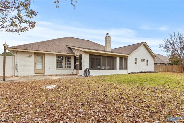 102 Bay Pointe Ln, Madison, AL 35758 - rear view of property with brick siding, a sunroom, a chimney, and a shingled roof