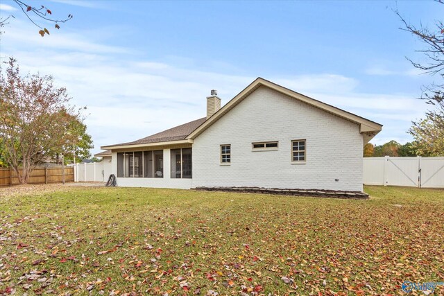 102 Bay Pointe Ln, Madison, AL 35758 - rear view of property with a chimney, a sunroom, brick siding, and a gate