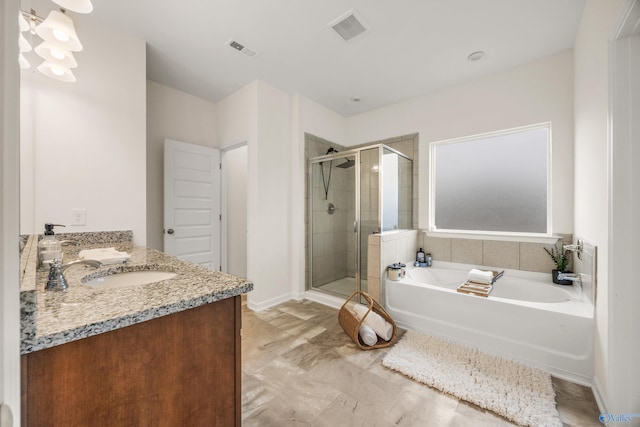 bathroom featuring independent shower and bath and vanity