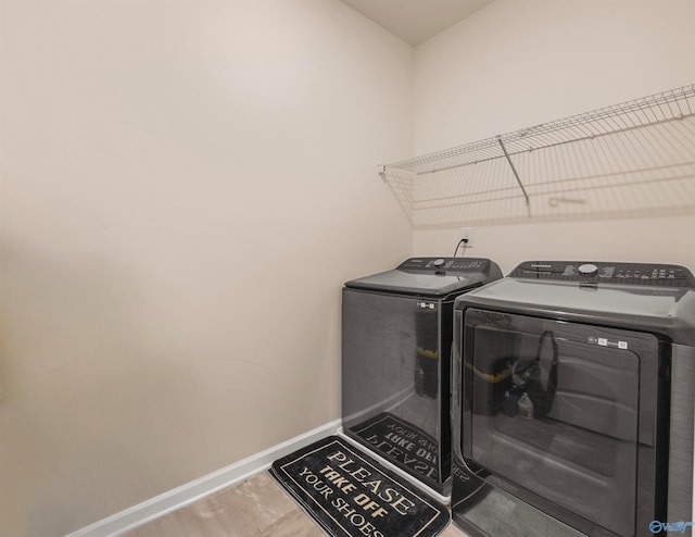 laundry area with washing machine and dryer