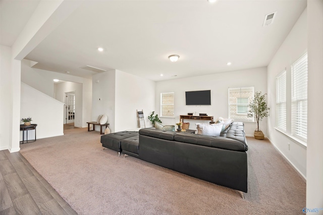 living room with light colored carpet