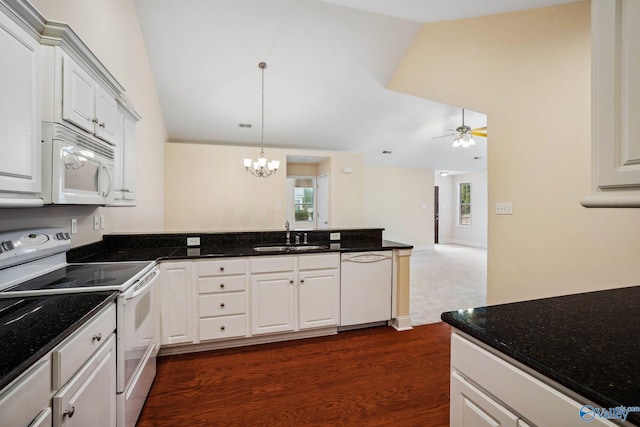 kitchen with dark hardwood / wood-style flooring, sink, white cabinets, and white appliances