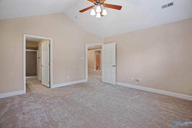 unfurnished bedroom with light carpet, high vaulted ceiling, and ceiling fan