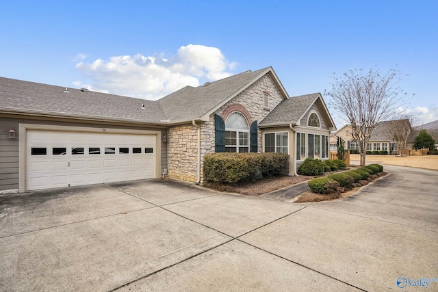 view of side of property featuring a garage