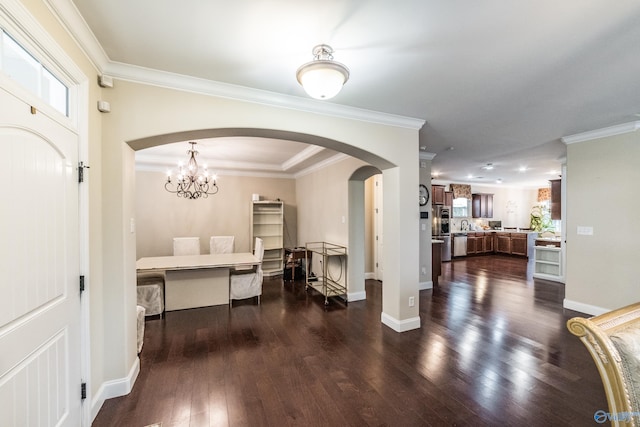 1117 Pegasus Dr NW, Huntsville, AL 35806 - entryway featuring arched walkways, dark wood-style floors, and crown molding