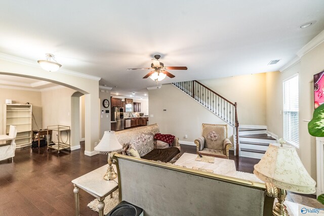 1117 Pegasus Dr NW, Huntsville, AL 35806 - living area with arched walkways, ceiling fan, dark wood-type flooring, stairs, and ornamental molding