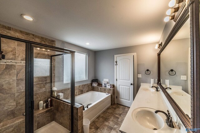 1117 Pegasus Dr NW, Huntsville, AL 35806 - full bathroom with a bath, double vanity, a stall shower, and recessed lighting