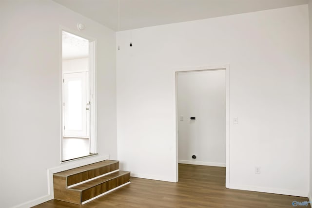 interior space featuring wood finished floors and baseboards