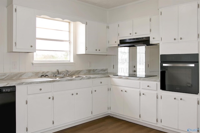 kitchen featuring white cabinetry, black appliances, under cabinet range hood, and a sink