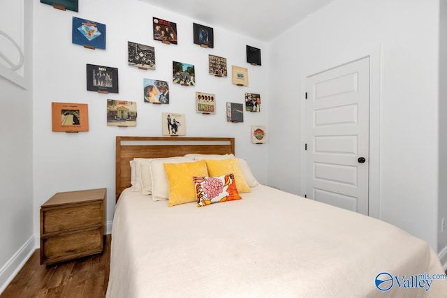 bedroom featuring dark hardwood / wood-style floors