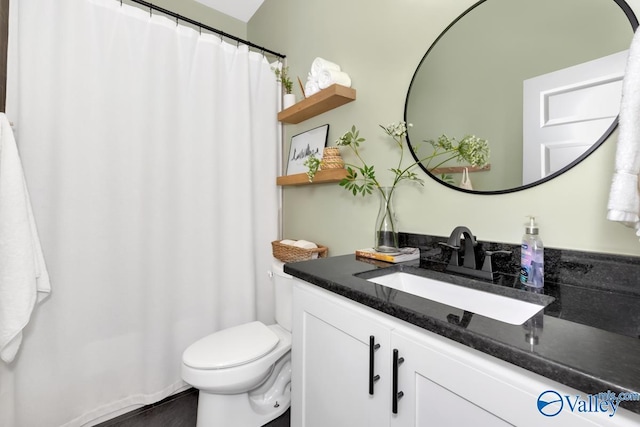 bathroom with vanity and toilet