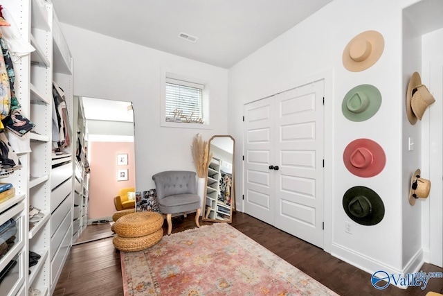 sitting room featuring dark wood-type flooring