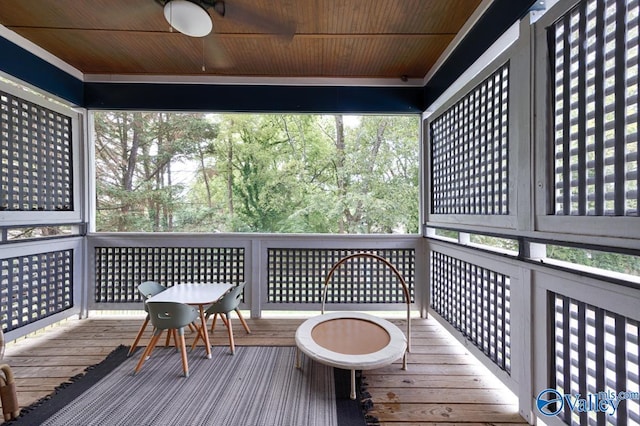 wooden deck featuring ceiling fan