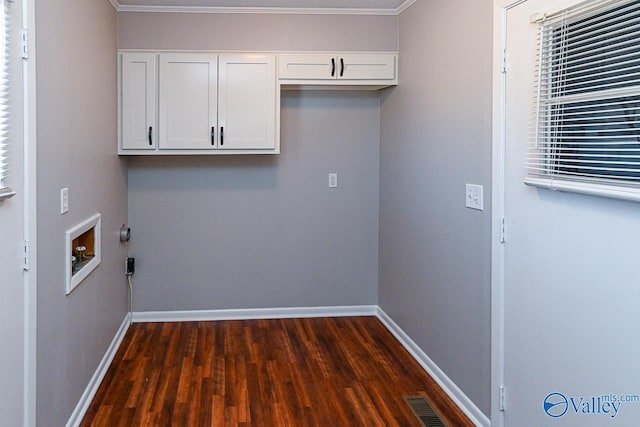 7853 Danville Rd, Danville, AL 35619 - laundry room featuring dark wood-type flooring, cabinet space, washer hookup, baseboards, and ornamental molding