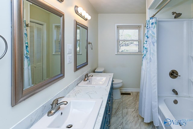 7853 Danville Rd, Danville, AL 35619 - bathroom featuring double vanity, toilet, shower / tub combo, and marble finish floors