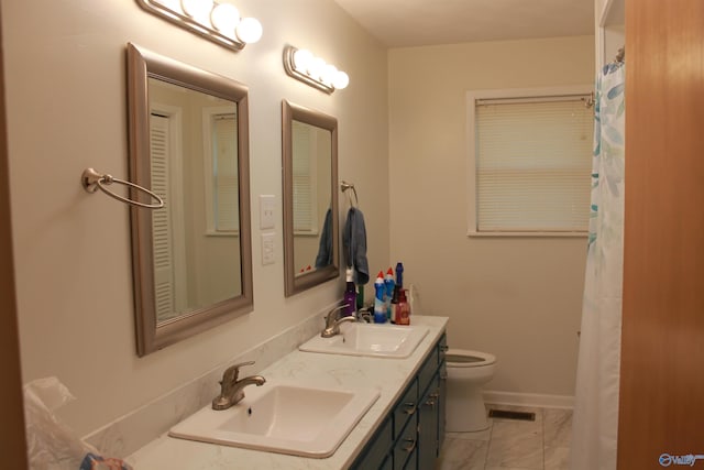 bathroom with toilet, marble finish floor, visible vents, and a sink