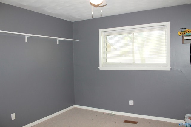 unfurnished room with baseboards