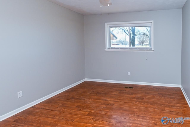 7853 Danville Rd, Danville, AL 35619 - unfurnished room featuring baseboards and wood finished floors