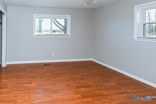 7853 Danville Rd, Danville, AL 35619 - unfurnished bedroom with baseboards and wood finished floors