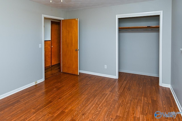 7853 Danville Rd, Danville, AL 35619 - unfurnished bedroom with wood finished floors, a closet, and baseboards