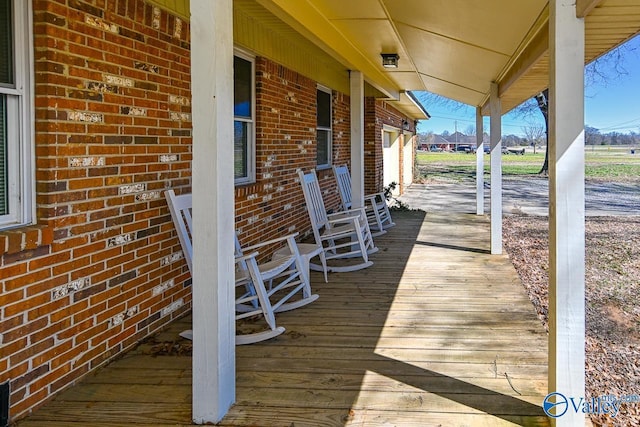 wooden deck featuring covered porch