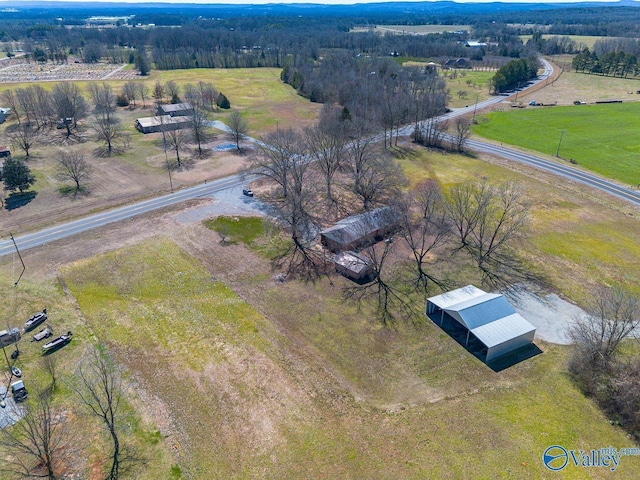 birds eye view of property with a rural view