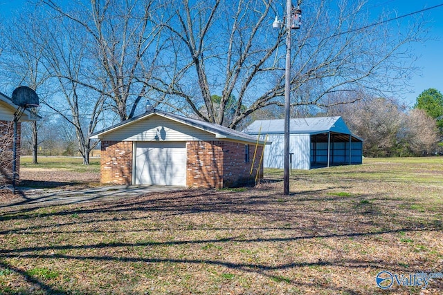 7853 Danville Rd, Danville, AL 35619 - view of pole building featuring driveway and a lawn