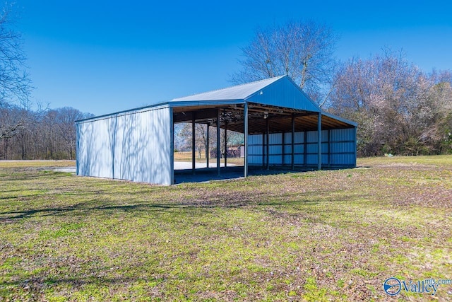 7853 Danville Rd, Danville, AL 35619 - view of pole building featuring a lawn and a detached carport