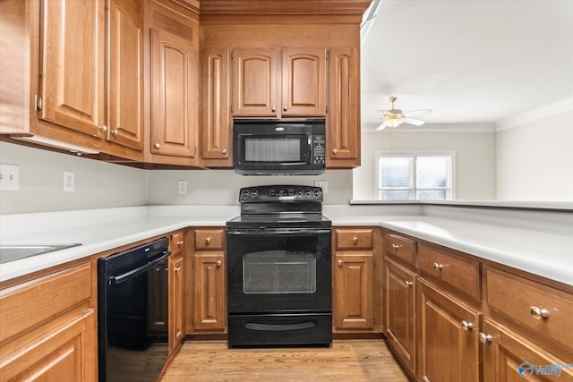 kitchen featuring ceiling fan, light hardwood / wood-style flooring, black appliances, and ornamental molding