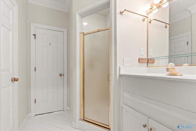 bathroom featuring vanity, tile patterned floors, walk in shower, and ornamental molding