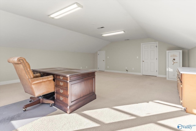 unfurnished office with light carpet and lofted ceiling