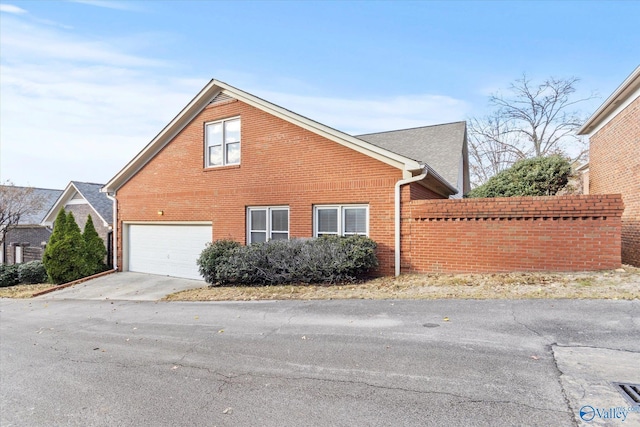 view of side of home with a garage