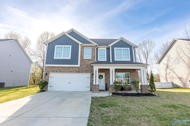 craftsman inspired home featuring concrete driveway, cooling unit, a front lawn, an attached garage, and brick siding