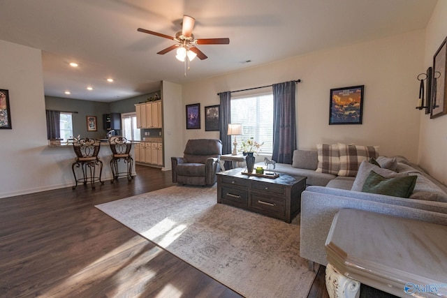 living room with recessed lighting, dark wood-type flooring, baseboards, and ceiling fan