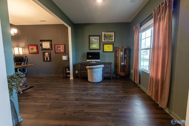 office area with visible vents, baseboards, and dark wood-style floors