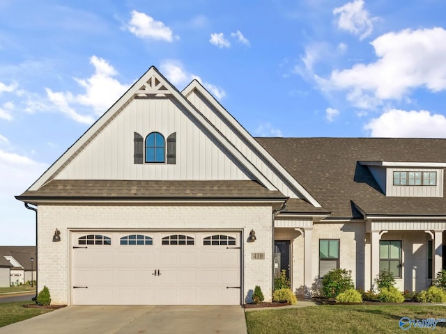 craftsman-style house with a front lawn and a garage