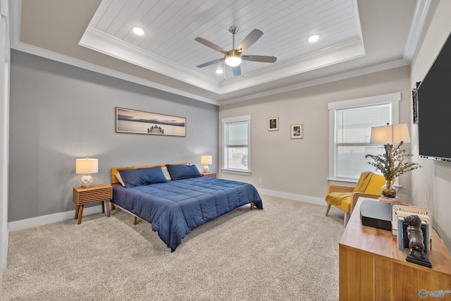 bedroom featuring carpet flooring, a tray ceiling, and ceiling fan