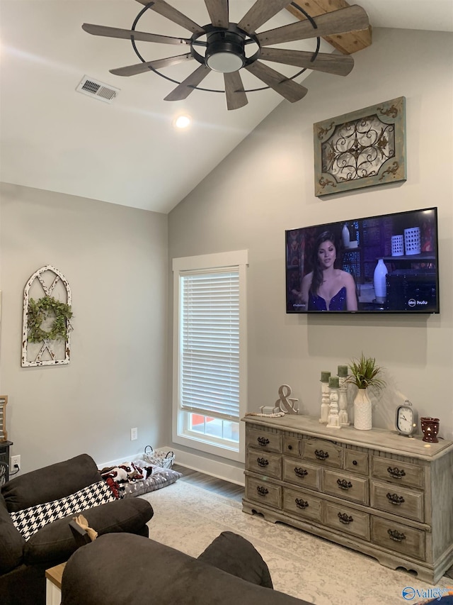 living room featuring lofted ceiling and ceiling fan