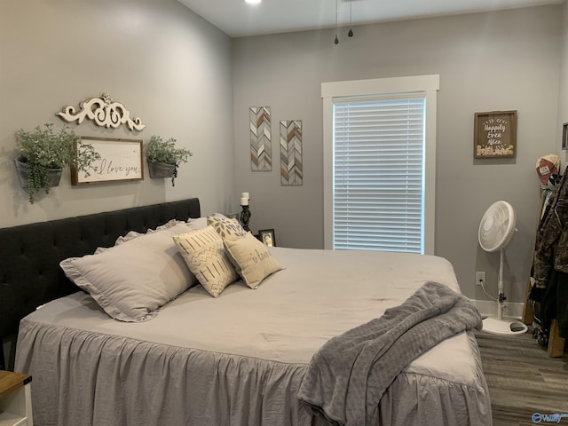 bedroom with wood-type flooring