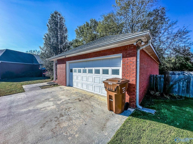 garage featuring a yard