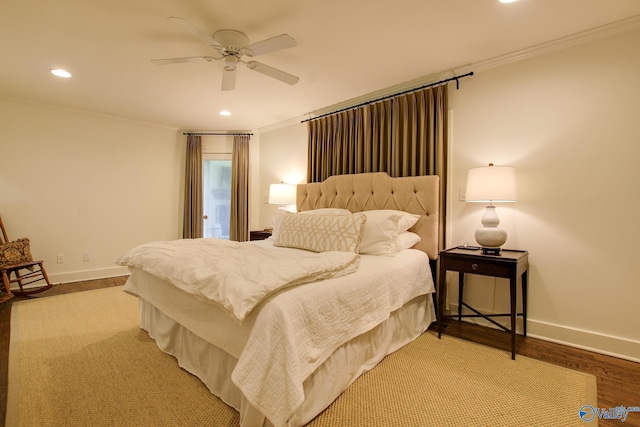 bedroom with crown molding, ceiling fan, and hardwood / wood-style flooring