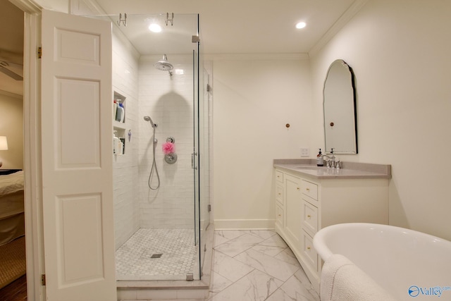 bathroom with vanity, ornamental molding, and shower with separate bathtub