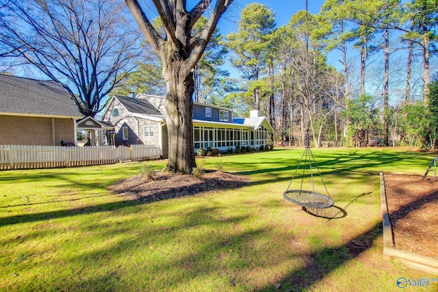 view of yard with a sunroom