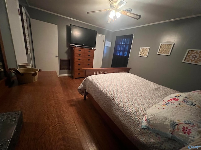 bedroom with hardwood / wood-style floors, ceiling fan, and ornamental molding