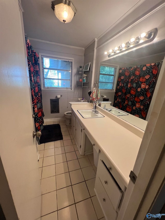 bathroom with tile patterned floors, toilet, ornamental molding, and vanity