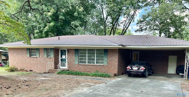 ranch-style house featuring a carport